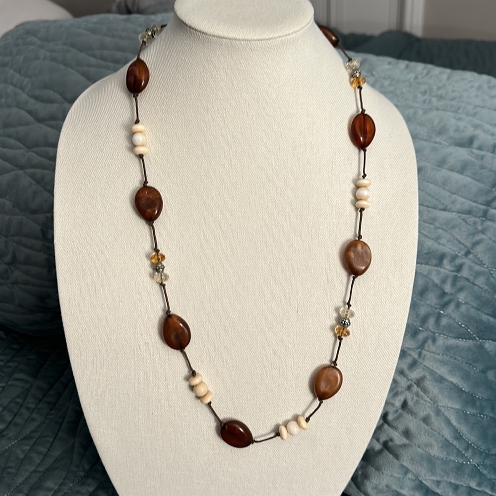Necklace brown tones with leather in between 32 inches long